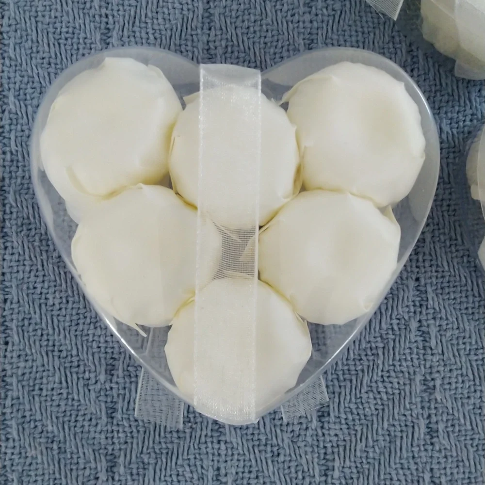 Rose petal soaps in white. Set of 3 hearts, each containing 6 soaps.